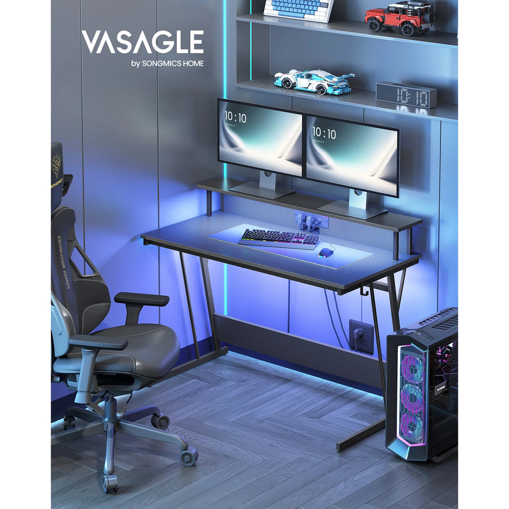 Escritorio para videojuegos VASAGLE: Luces LED, enchufes integrados. Estante para 2 monitores. Escritorio para oficina/dormitorio. 60 x 120 x 76 cm. Color negro carbón.